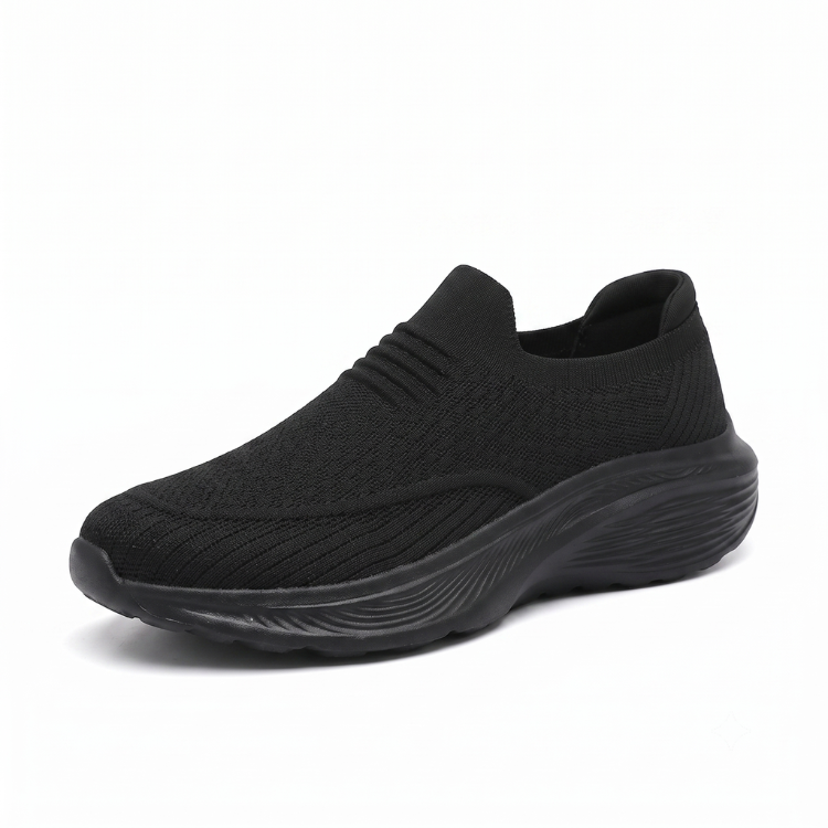 Svart slip-on komfortsko unisex med tjock stötdämpande sula och mjukt sticktyg mot vit bakgrund